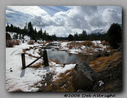 Carson River with snow on banks on Hope Valley, CA