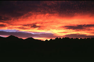 Sunset over the desert with red sky near the Sweetwater Mountains, CA