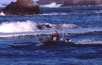 Ocean boat and crab fishermen in rough water with breaking waves of ocean