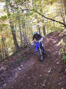 A dirt-biker enjoys the scenery and trail at the SWR Trail Ride
