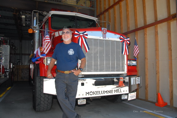 Firefighter Chat Soule with Water Tender 159 decorated with flags