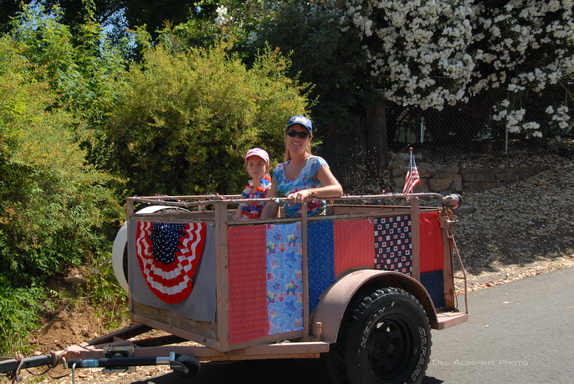Stacie and Jessica in decorated parade chariot