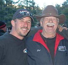 Kevin Carey (L) with Del, around the camp fire.