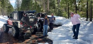 Snow wheeling friends on snow road